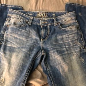 Buckle black skinny jeans